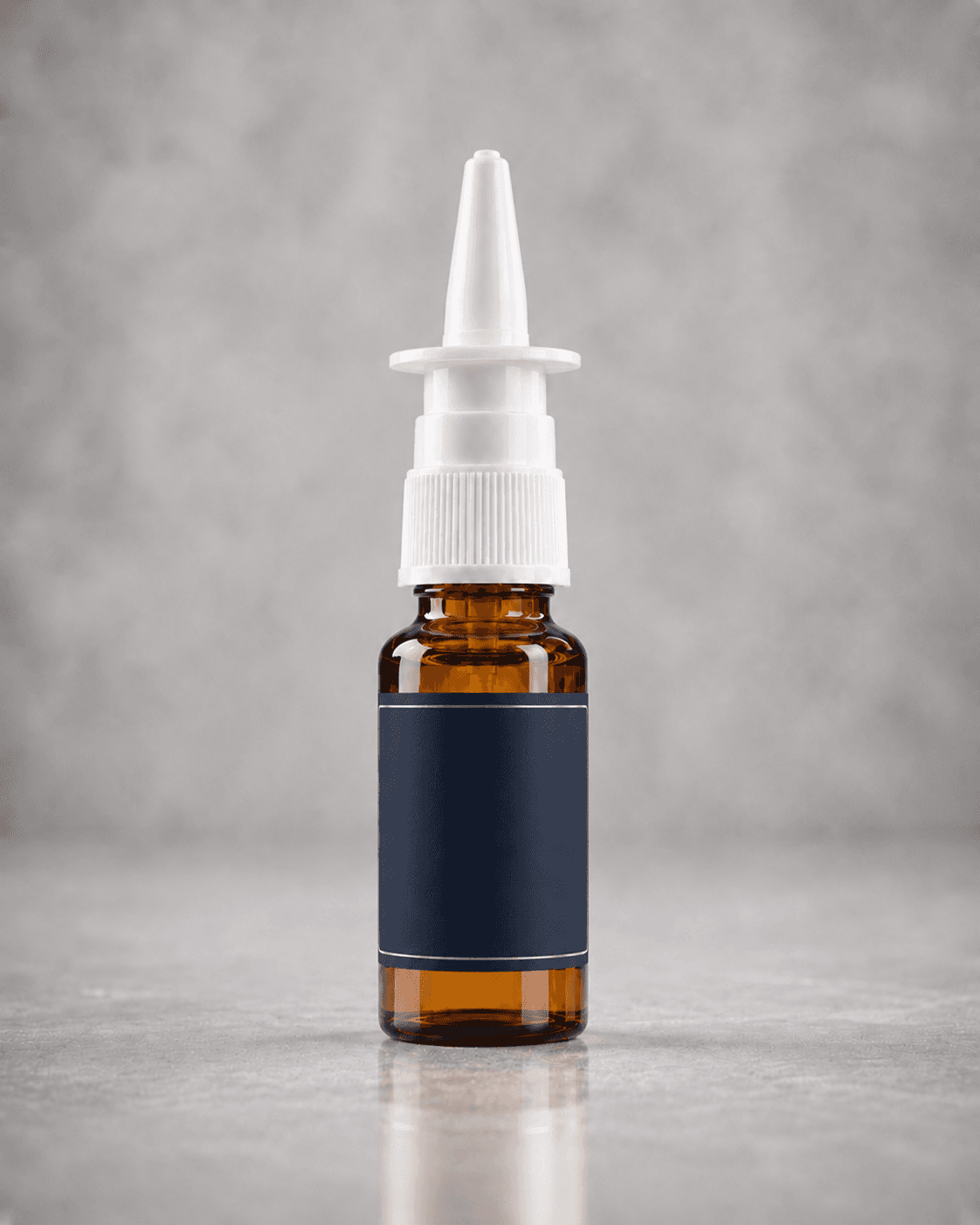 Amber compounded nasal spray bottle on pale stone.